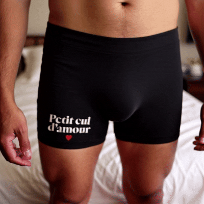 Slip noir avec inscription "Petit cul d'amour"